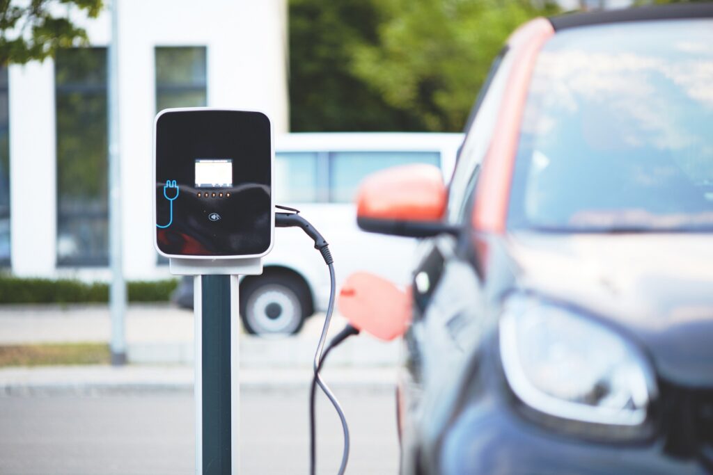 Image of an electric car being charged at a charging station